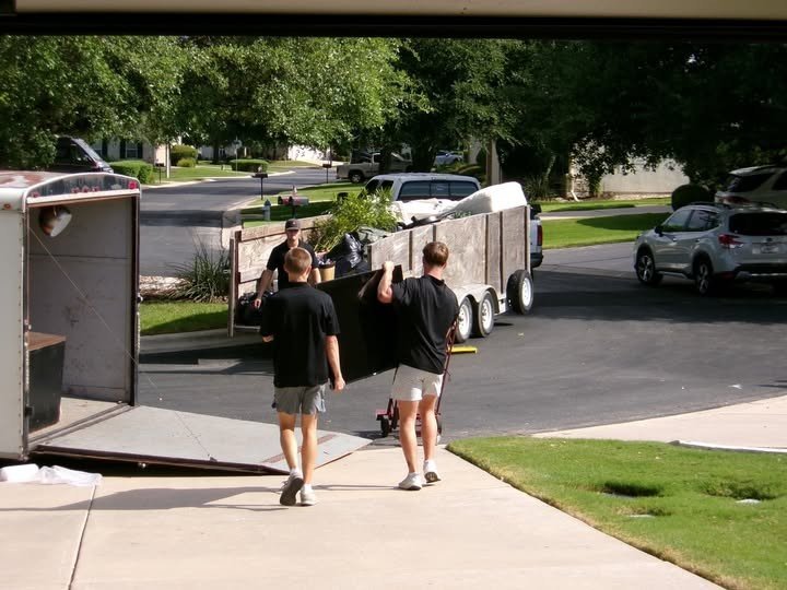 Settled in Texas team carrying furniture during a residential move